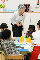Empress Michiko visits day-care center in Tokyo's Shiodome