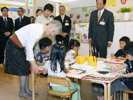 Empress Michiko visits day-care center in Tokyo's Shiodome