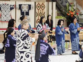 Wives experience Ainu dance in Hokkaido