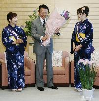 PM Aso receives courtesy call from 'iris' women