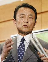 Japan sets new fiscal plans, social security cuts put on ice