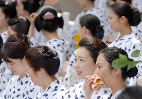 Geisha women pray at Kyoto summer event