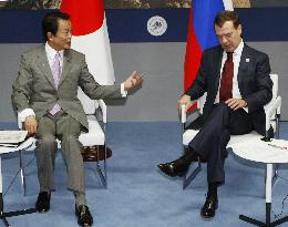 Aso, Medvedev meet in Italy