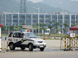 Police vehicle keeps watch in China's Shaoguan city