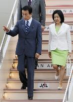 Aso returns home after G-8 summit in Italy