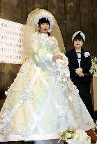 Humanoid model walks on catwalk in wedding gown