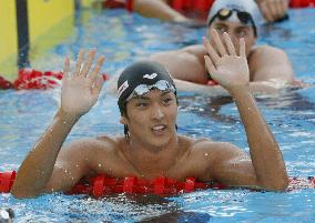 Koga wins gold in 100m backstroke