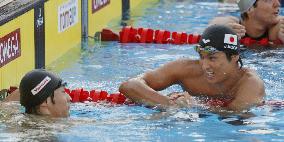 Koga wins gold in 100m backstroke