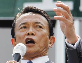 Aso, Hatoyama trade criticism over policy platforms