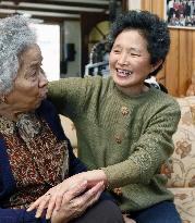 Japanese woman helping Japanese-Dutch search for their fathers