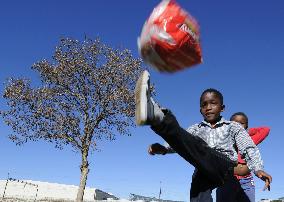S. African children play soccer