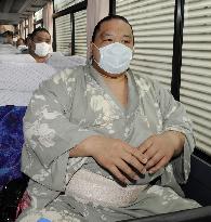 Sumo wrestlers wear masks