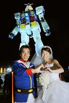 Wedding ceremony in front of Mobile Suit Gundam statue in Tokyo