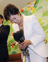 LDP's Koike narrowly secures reelection