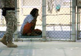 Guantanamo detainee sits in yard
