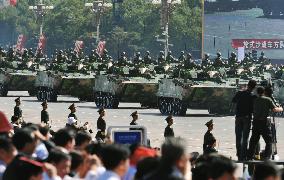 Beijing shows off new weaponry in 60th anniversary parade