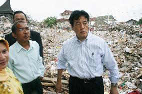 Okada inspects earthquake damage in Indonesia