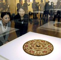 Round decorative mirror in Nara's repository