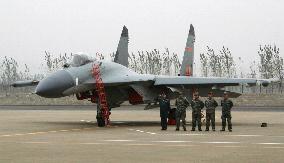 China unveils J-11 fighter