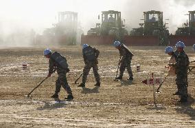 China offers press viewing of land mine clearing drill