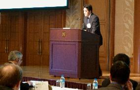 Okada speaks at APEC symposium