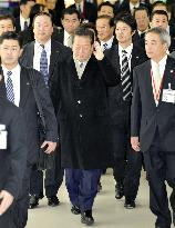 Japan power broker Ozawa leaves for Beijing