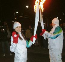 Figure skater Kim carries Olympic torch