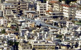 U.S. military plane flies over Okinawa city