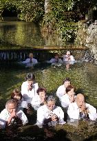 People purify themselves by bathing in cold water at Koyasan