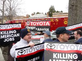 U.S. auto workers' union members stage rally against Toyota