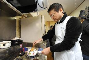 Japan welfare minister helps elderly people
