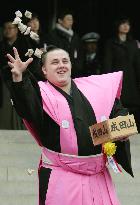 Baruto throws beans for luck at Narita temple