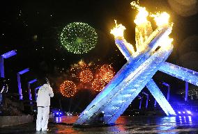 Olympic flame lit at opening ceremony