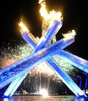 Olympic flame lit at opening ceremony