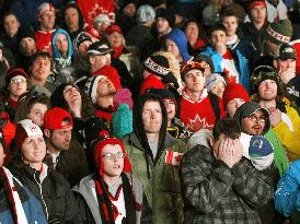 Spectators react after U.S. beat Canada in men's ice hockey