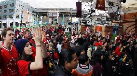 Olympics closing ceremony spectators cheer for Canada's hockey gold