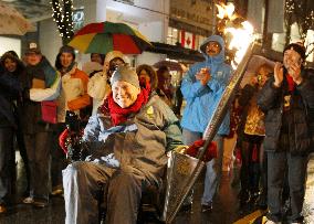 Former Vancouver mayor carries Paralympic torch