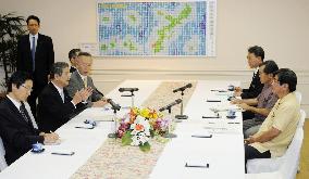 Defense minister in Okinawa