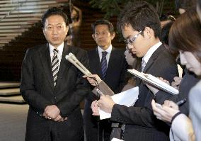 Hatoyama speaks to reporters before leaving for Washington