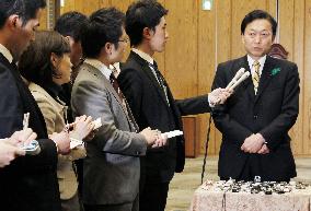 Embattled Hatoyama meets press