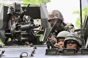 Thai protest leaders surrender, curfew set for Bangkok