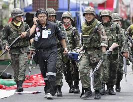 Thai protest leaders surrender, curfew set for Bangkok