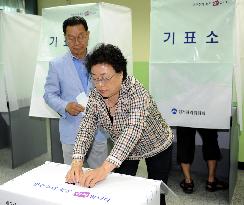 S. Koreans vote in local elections overshadowed by ship sinking