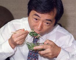 Kan eats radish sprouts