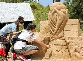 Sand sculpture of World Cup trophy at Tottori Dune