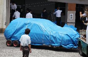 1 dead as alleged ex-Mazda temp hits 11 plant workers with car
