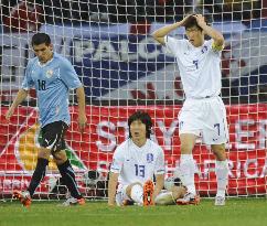CORRECTED Uruguay beat S. Korea in World Cup round of 16