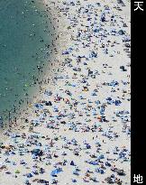 Crowded beach in sizzling Japan