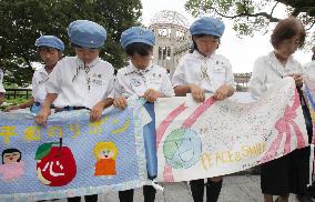 Banners for peace encircle A-Bomb Dome in Hiroshima