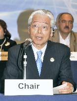 Economy minister Naoshima reads statement at APEC meeting